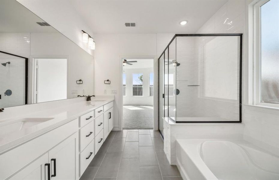 Airy bathroom with dual vanity *real home pictured