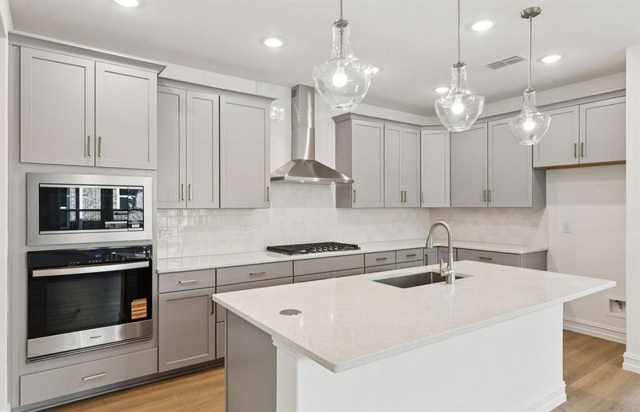 Spacious eat-in kitchen designed with a nice island for dining Spacious eat-in kitchen designed with a nice island for dining