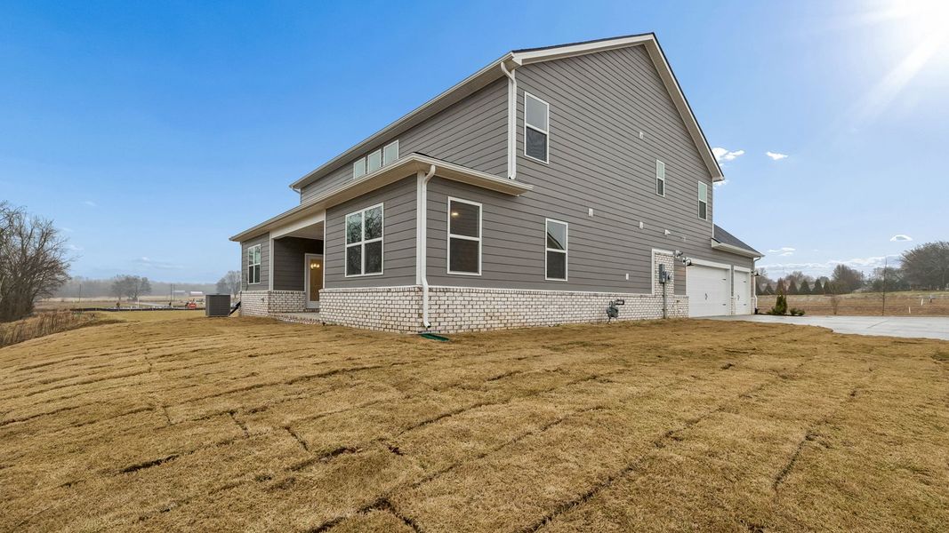 Exterior details and patio area of a home in Harvest Point, Spring Hill (Image 33).
