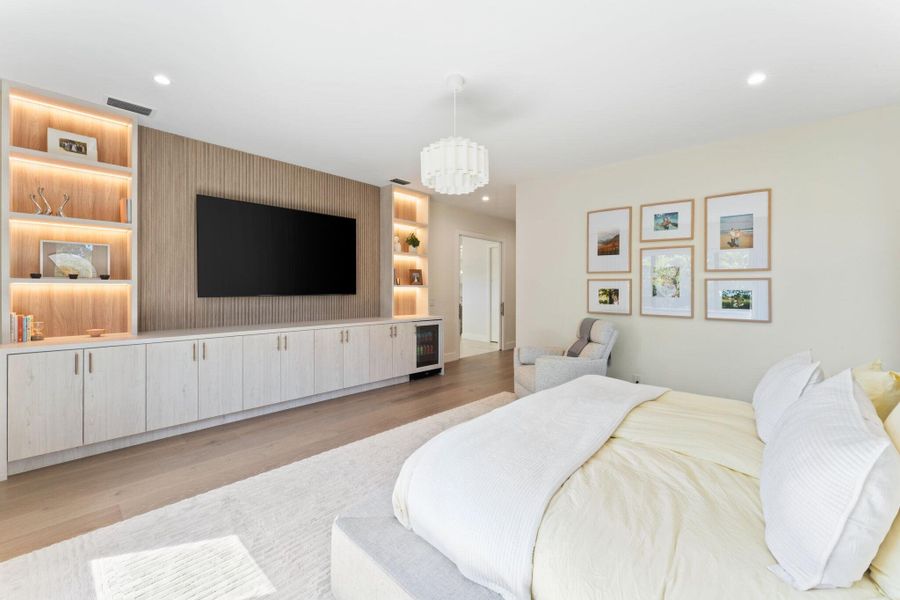 primary bedroom with custom built-in primary bedroom with custom built-in