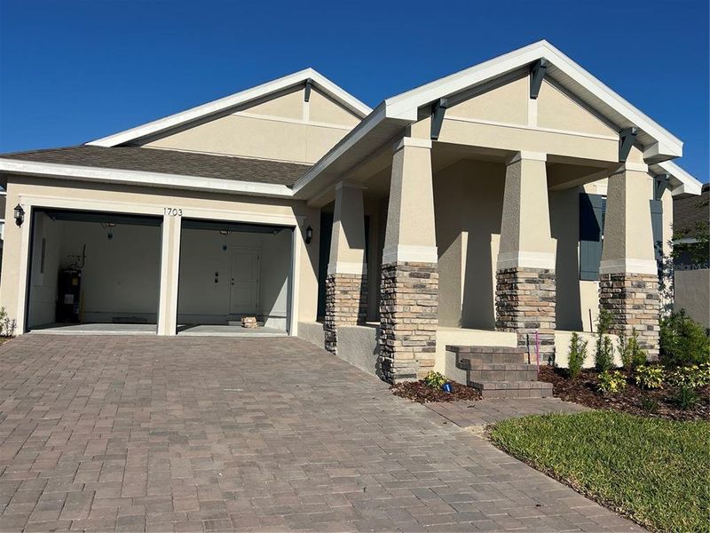 Front exterior of a new home in Hills of Minneola, Minneola, FL, highlighting curb appeal (Image 1). Front exterior of a new home in Hills of Minneola, Minneola, FL, highlighting curb appeal (Image 1).