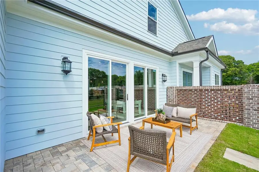 Exterior details and patio area of a home in The Villas at Aberdeen, Hoschton (Image 3).