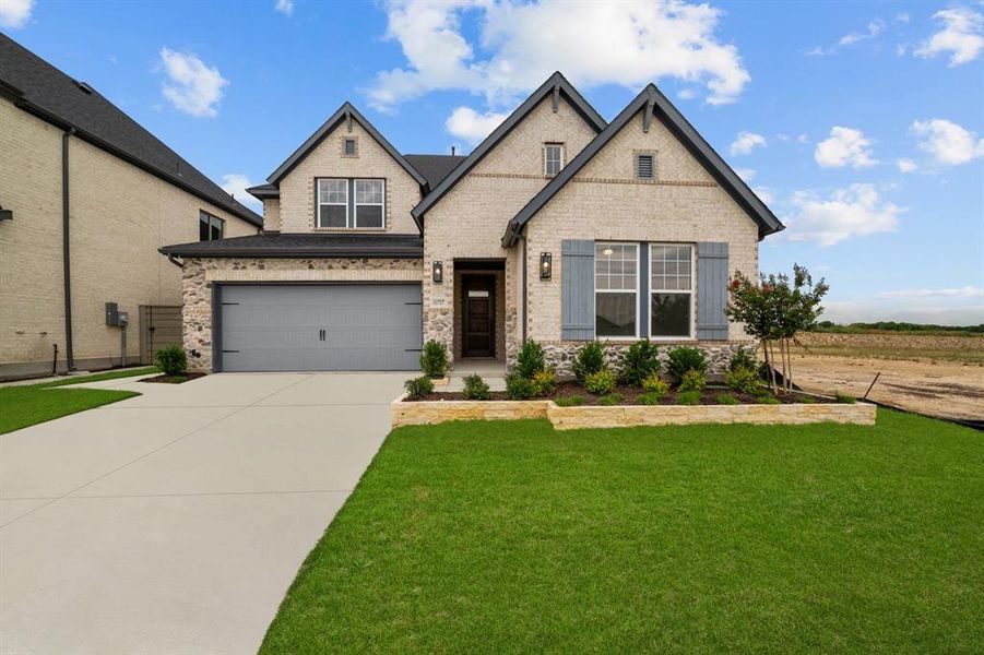 Front exterior of a new home in Treeline, Justin, TX, highlighting curb appeal (Image 2).