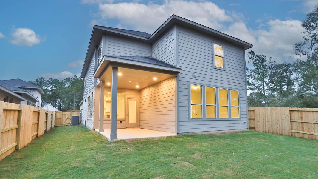 Exterior details and patio area of a home in Woodhavyn 40', Magnolia (Image 3).