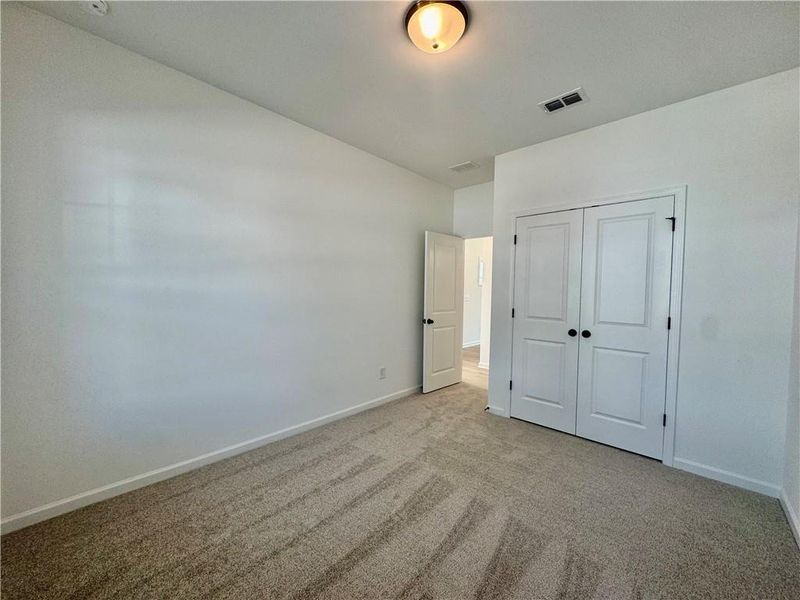 Spacious, unfurnished interior of a new home in Eastlyn Crossing, Flowery Branch (Image 16).