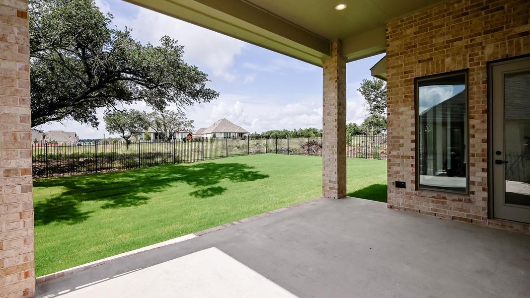 Fenced backyard featuring a patio area Fenced backyard featuring a patio area
