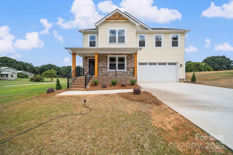 Front exterior of a new home in , Wingate, NC, highlighting curb appeal (Image 2).
