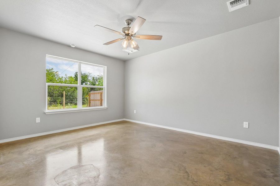 A quiet, airy room with polished concrete flooring and a view of the natural surroundings. A quiet, airy room with polished concrete flooring and a view of the natural surroundings.