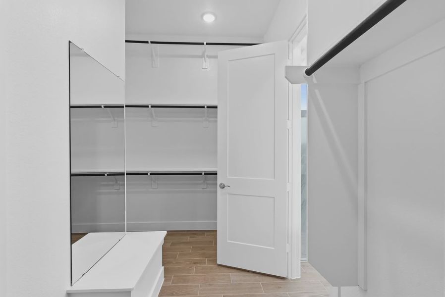 Representative furnished interior of a home built from the Summerton by Chesmar Homes in Beacon Point, Texas City (Image 14).