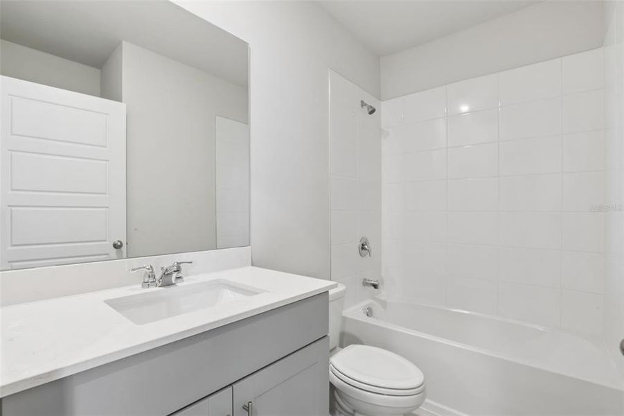 Furnished interior view inside a new home in Crescent Lakes - Premier Series, Punta Gorda (Image 11).