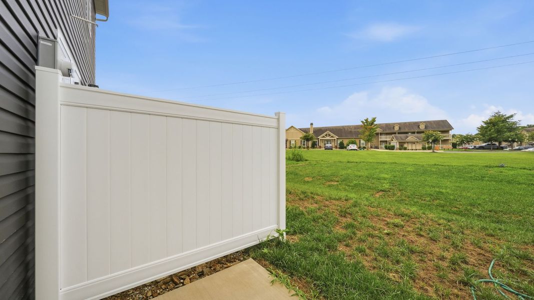 Exterior details and patio area of a home in The Arbor Townhomes, Kingsport (Image 4).