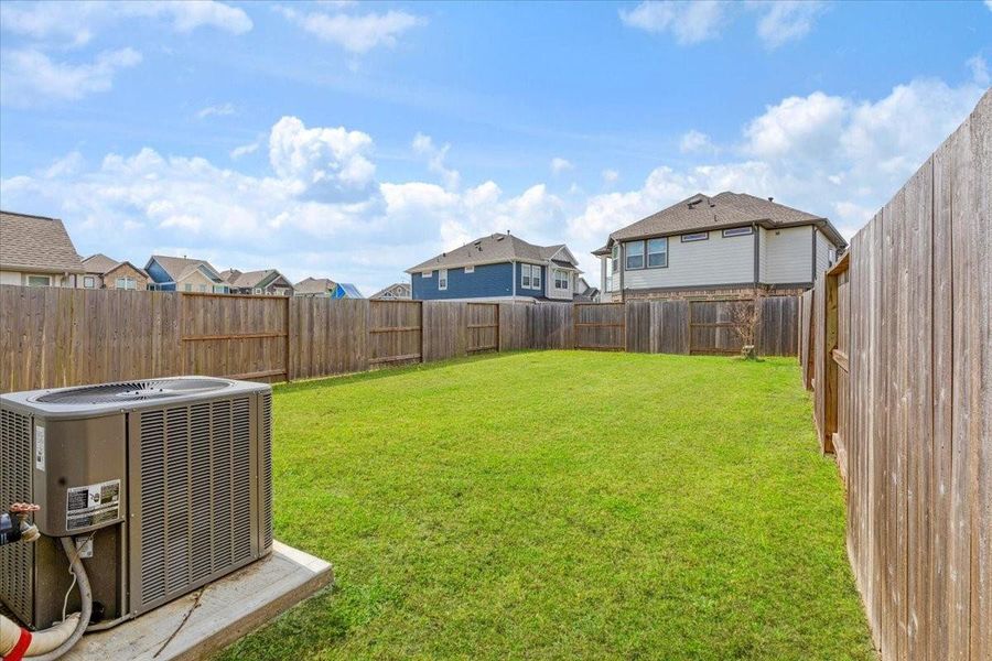 Exterior details and patio area of a home in Meridiana, Iowa Colony (Image 4).
