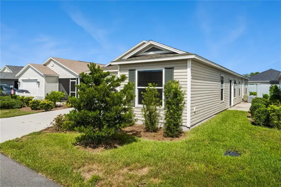 Front exterior of a new home in , The Villages, FL, highlighting curb appeal (Image 1). Front exterior of a new home in , The Villages, FL, highlighting curb appeal (Image 1).