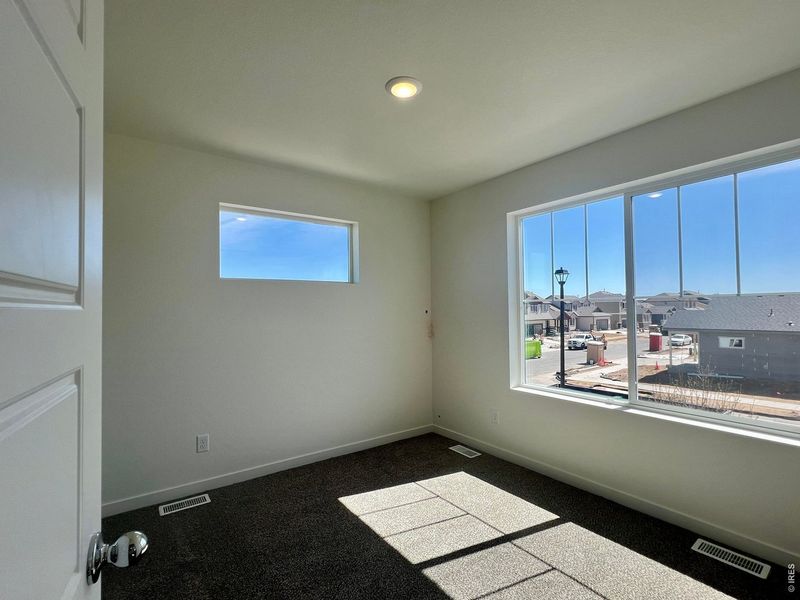 Spacious, unfurnished interior of a new home in Union Colony West, Greeley (Image 11).