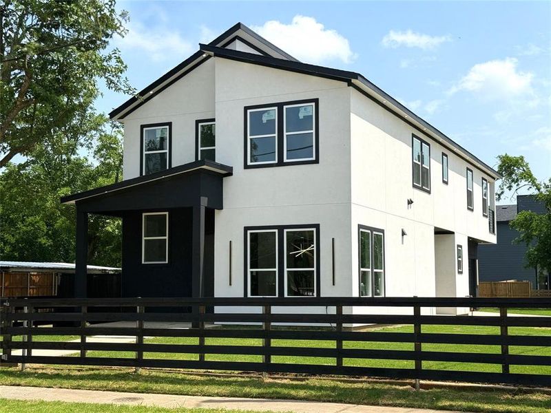 Front exterior of a new home in , Dallas, TX, highlighting curb appeal (Image 22).
