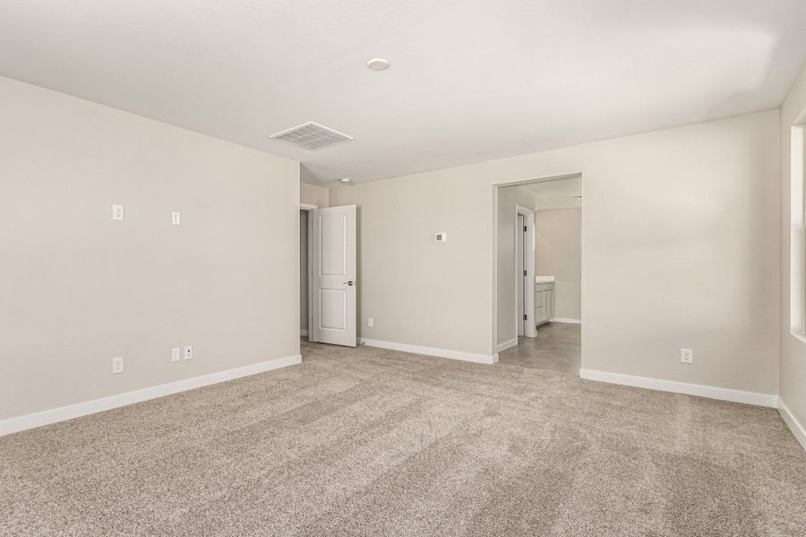 Spacious, unfurnished interior of a new home in Bentridge – Canyon Series, Buckeye (Image 7). Spacious, unfurnished interior of a new home in Bentridge – Canyon Series, Buckeye (Image 7).