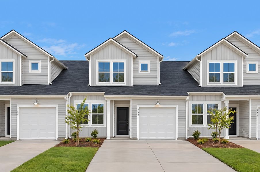 Front exterior of a new home in Champions Park, Little River, SC, highlighting curb appeal (Image 1). Front exterior of a new home in Champions Park, Little River, SC, highlighting curb appeal (Image 1).