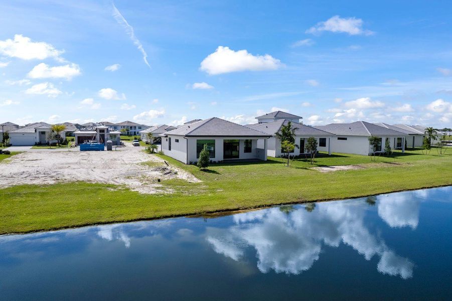 Front exterior of a new home in Cresswind Palm Beach at Westlake, Westlake, FL, highlighting curb appeal (Image 1).