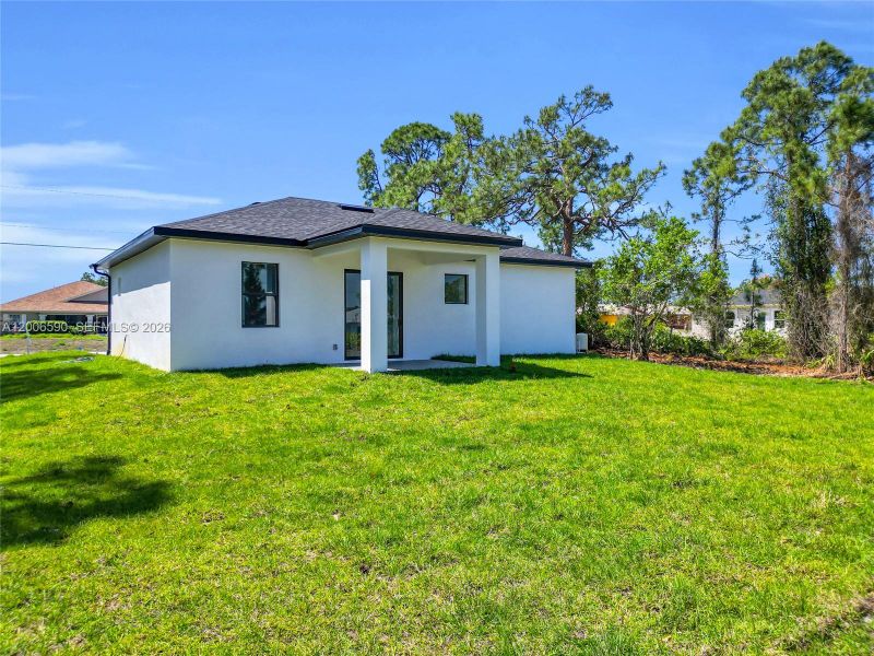 Exterior details and patio area of a home in , Lehigh Acres (Image 4).