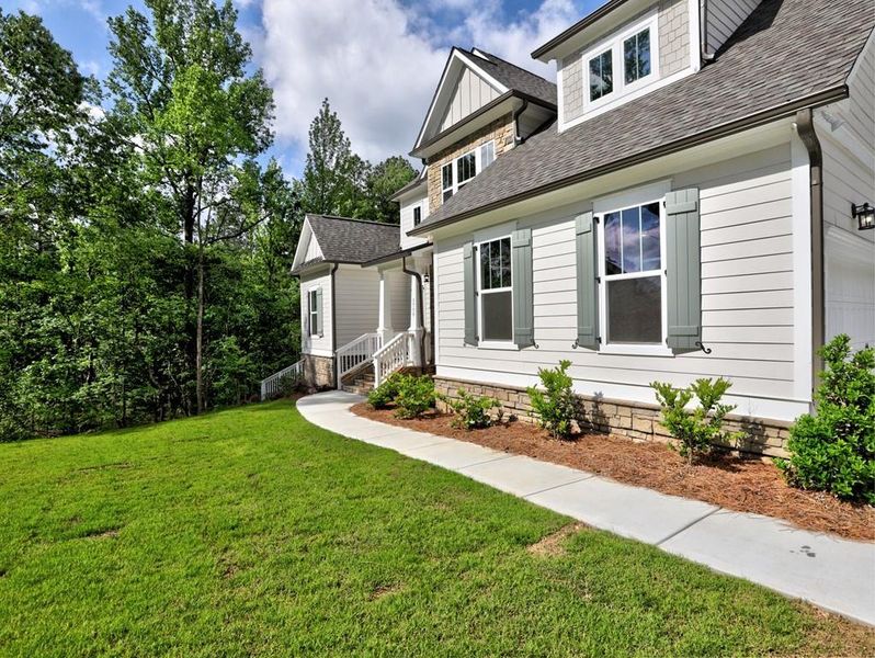 Front exterior of a new home in , Cumming, GA, highlighting curb appeal (Image 15). Front exterior of a new home in , Cumming, GA, highlighting curb appeal (Image 15).