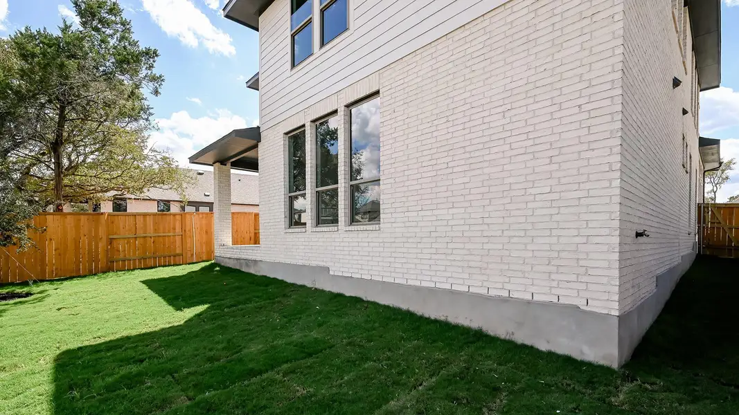 View of side of property with brick siding