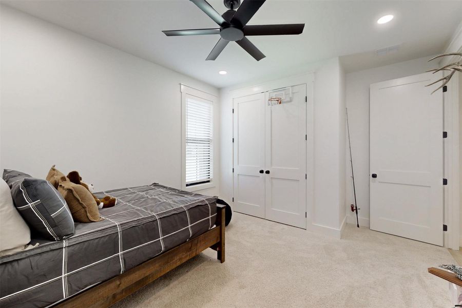 Bedroom with carpet, recessed lighting, a ceiling fan, and a closet