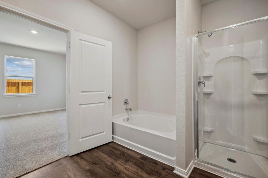 Primary Bathroom comes with a separate soaking tub and shower