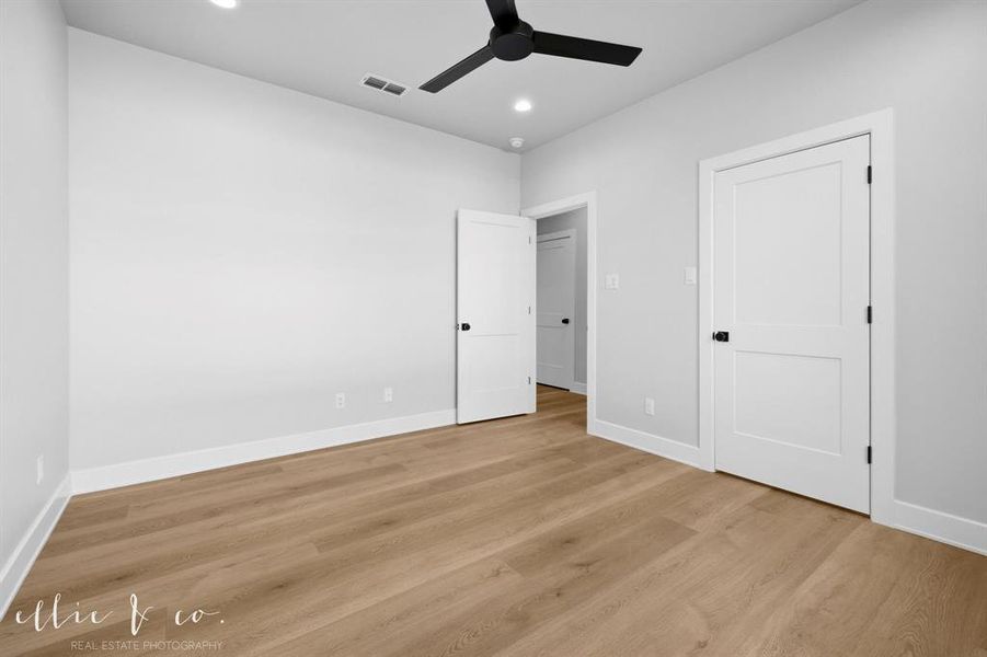 Unfurnished bedroom featuring a ceiling fan, light wood-style floors, and recessed lighting