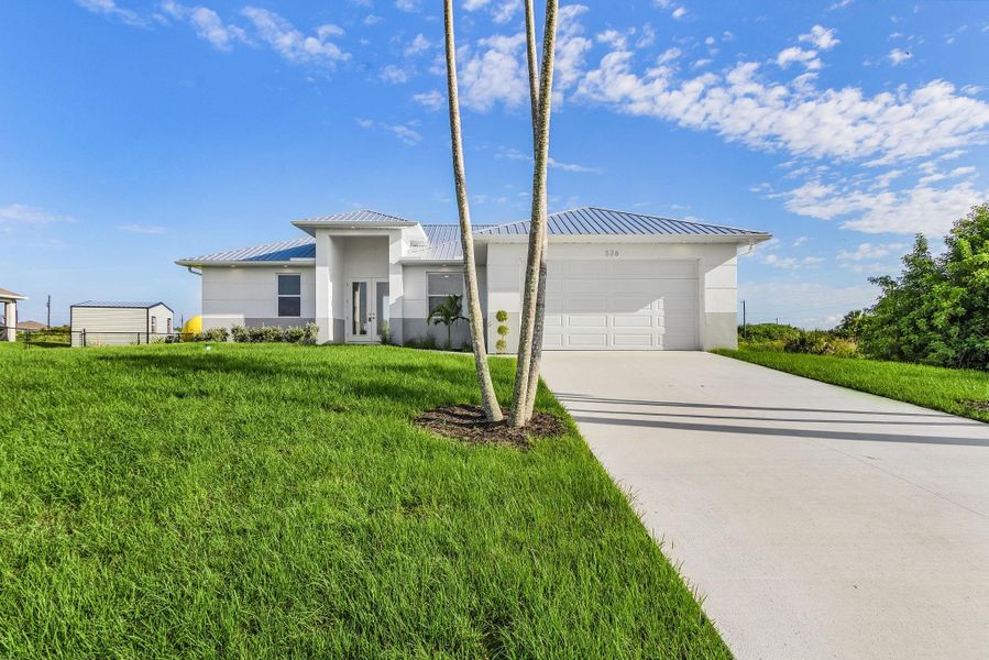 Front exterior of a new home in , Port LaBelle, FL, highlighting curb appeal (Image 13).