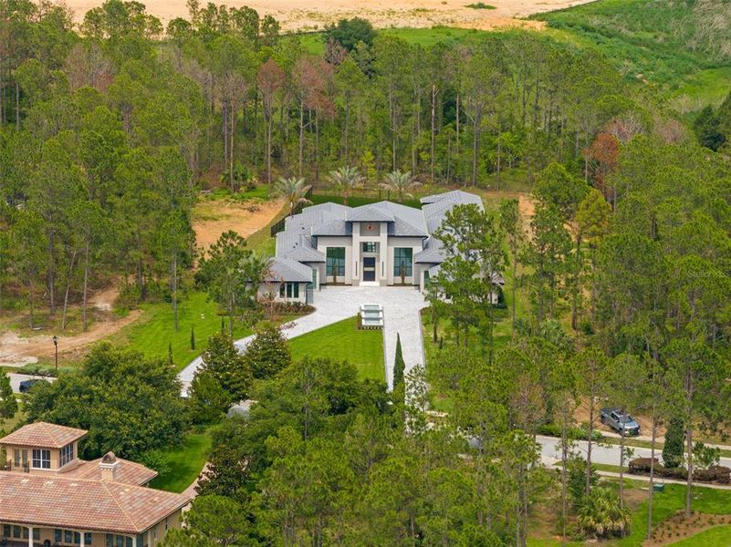 Front exterior of a new home in , Montverde, FL, highlighting curb appeal (Image 25).