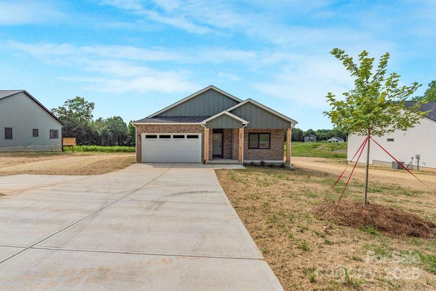 Front exterior of a new home in , Lincolnton, NC, highlighting curb appeal (Image 2).