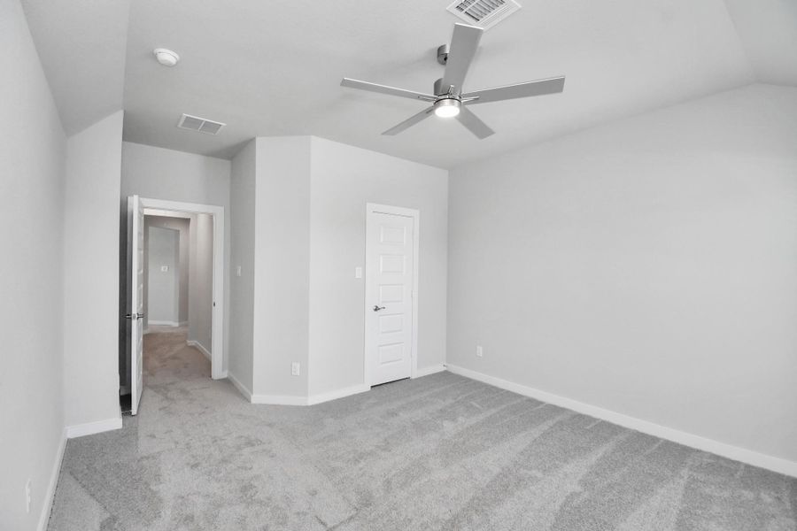 Generously sized secondary bedrooms featuring spacious closets, soft and inviting carpeting underfoot, large windows allowing plenty of natural light, and the added touch of privacy blinds for your personal retreat.