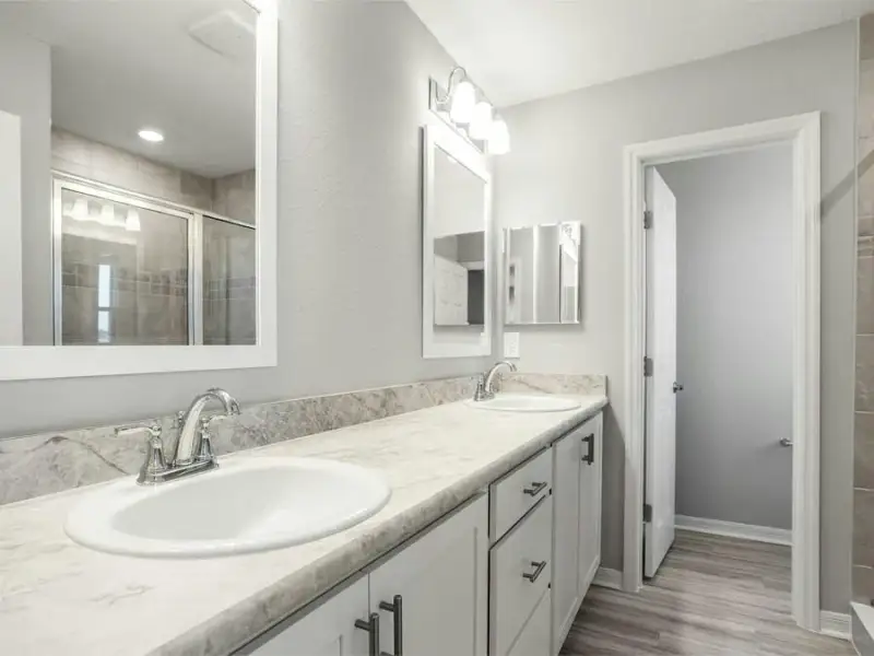 Your suite is complete with a walk-in wardrobe and a private en-suite bath with a tiled shower.