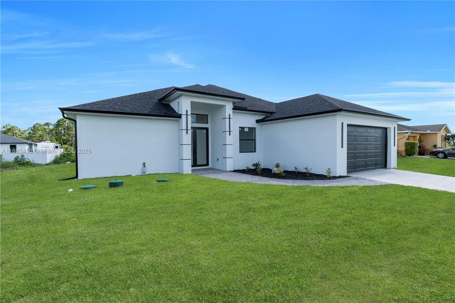 Front exterior of a new home in , Lehigh Acres, FL, highlighting curb appeal (Image 20). Front exterior of a new home in , Lehigh Acres, FL, highlighting curb appeal (Image 20).