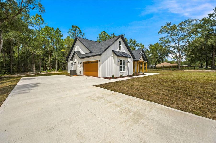 Front exterior of a new home in , Ocala, FL, highlighting curb appeal (Image 22). Front exterior of a new home in , Ocala, FL, highlighting curb appeal (Image 22).