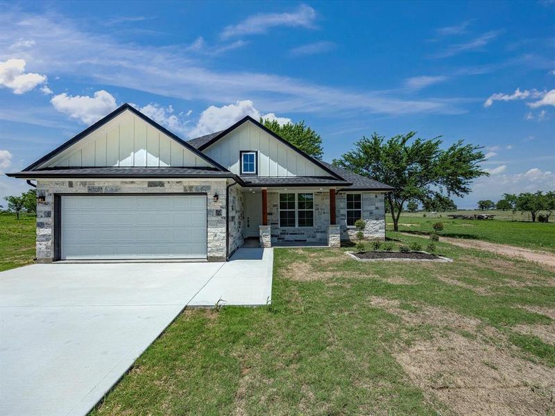 Front exterior of a new home in , Bowie, TX, highlighting curb appeal (Image 17).