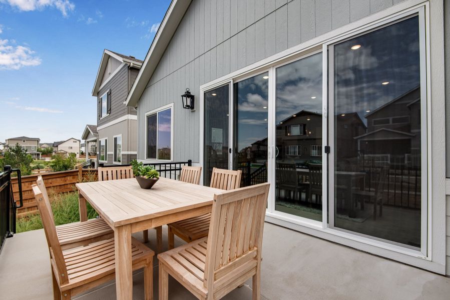 Exterior details and patio area of a home in Reunion, Commerce City (Image 26).