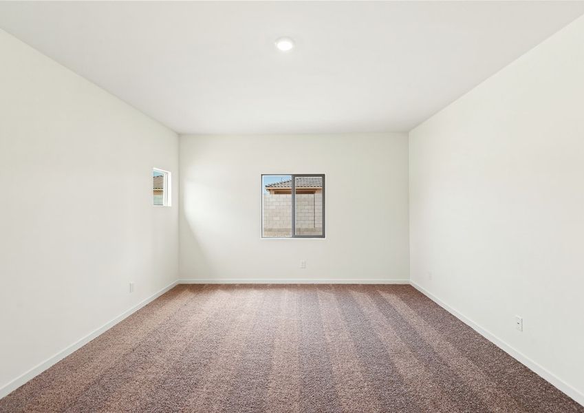 The master bedroom is the perfect spacious room to unwind after a long day.