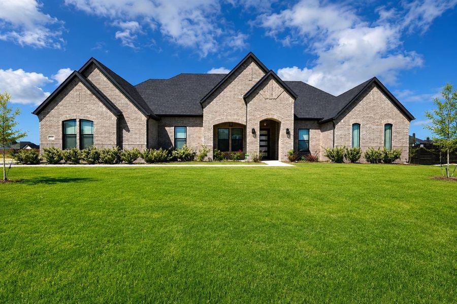 Front exterior of a new home in , Waxahachie, TX, highlighting curb appeal (Image 1). Front exterior of a new home in , Waxahachie, TX, highlighting curb appeal (Image 1).