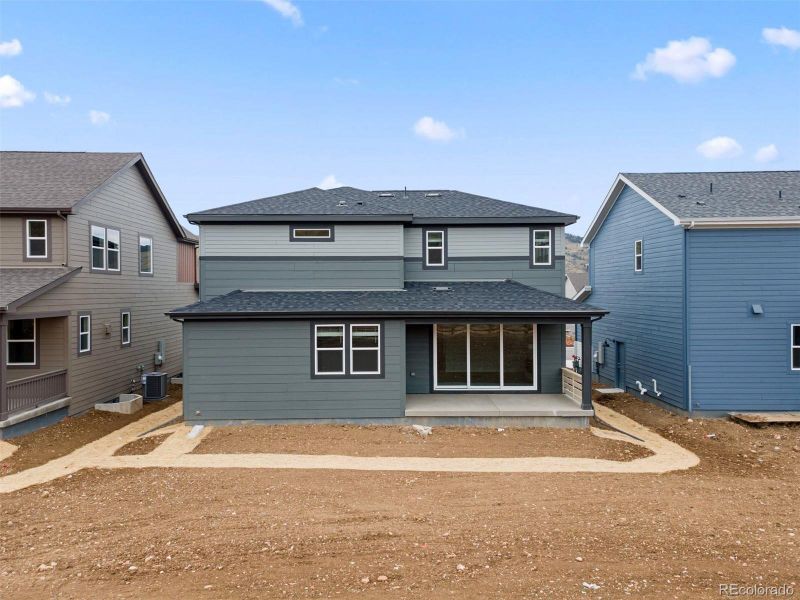 Exterior details and patio area of a home in The Manors Collection at Golden Overlook, Golden (Image 1).