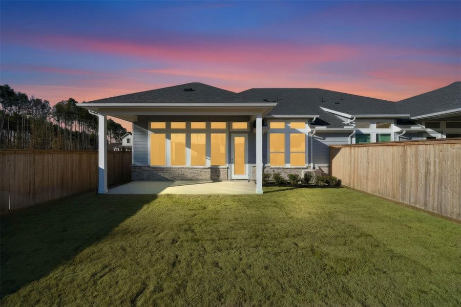 The covered patio offers a functional extension of your indoor living space, providing shade from the sun and shelter from the elements for comfortable outdoor dining or relaxation.