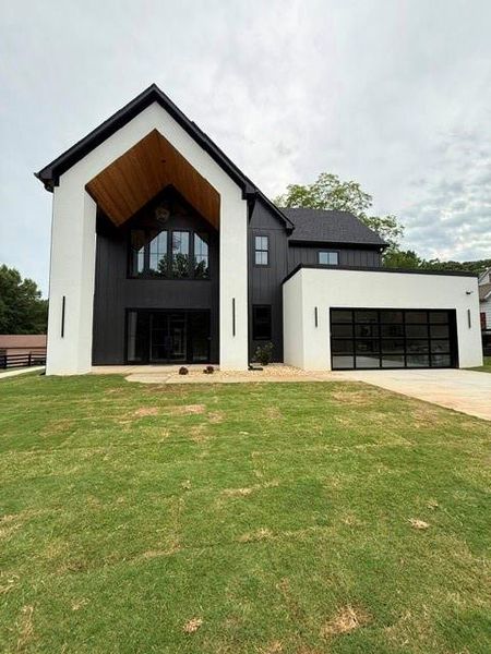 Front exterior of a new home in , Buford, GA, highlighting curb appeal (Image 35). Front exterior of a new home in , Buford, GA, highlighting curb appeal (Image 35).
