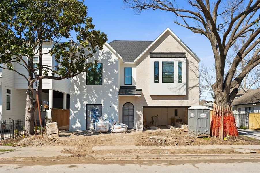 Welcome to 203 E 24th Street! This stunning home is on a beautiful tree-lined curbed & guttered street, walking distance to Halbert Park! The exterior features a stucco finish, brick facade and steel doors. Completion March 2025!