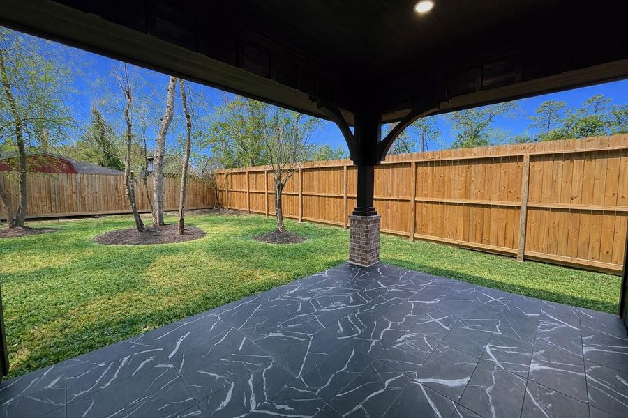 View of yard from covered patioenhanced image