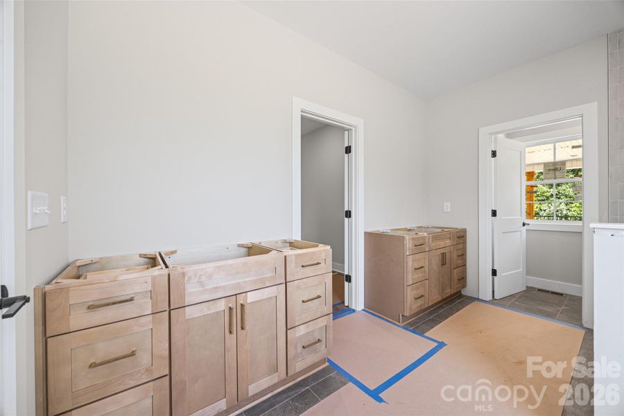 Primary bath features dual vanities.