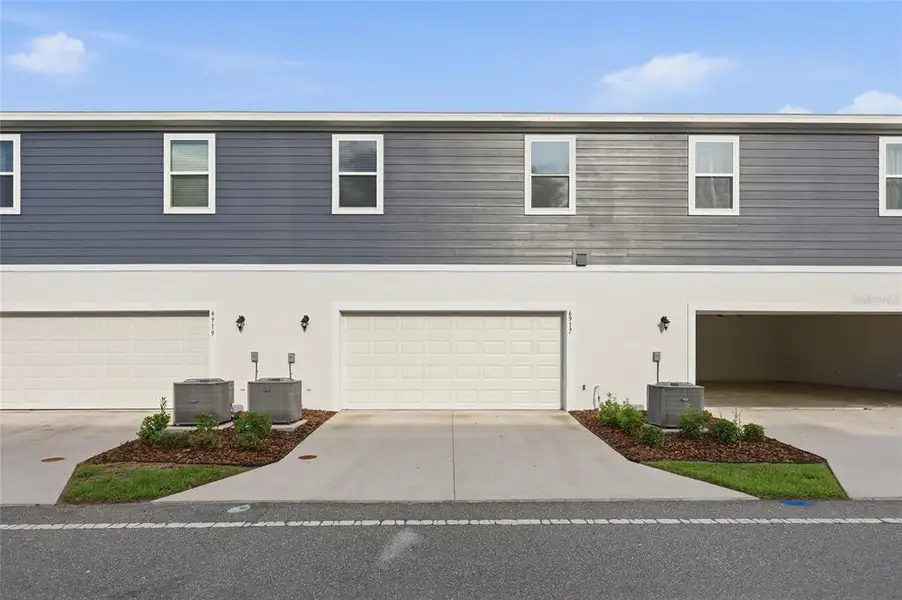 Front exterior of a new home in , Harmony, FL, highlighting curb appeal (Image 22). Front exterior of a new home in , Harmony, FL, highlighting curb appeal (Image 22).