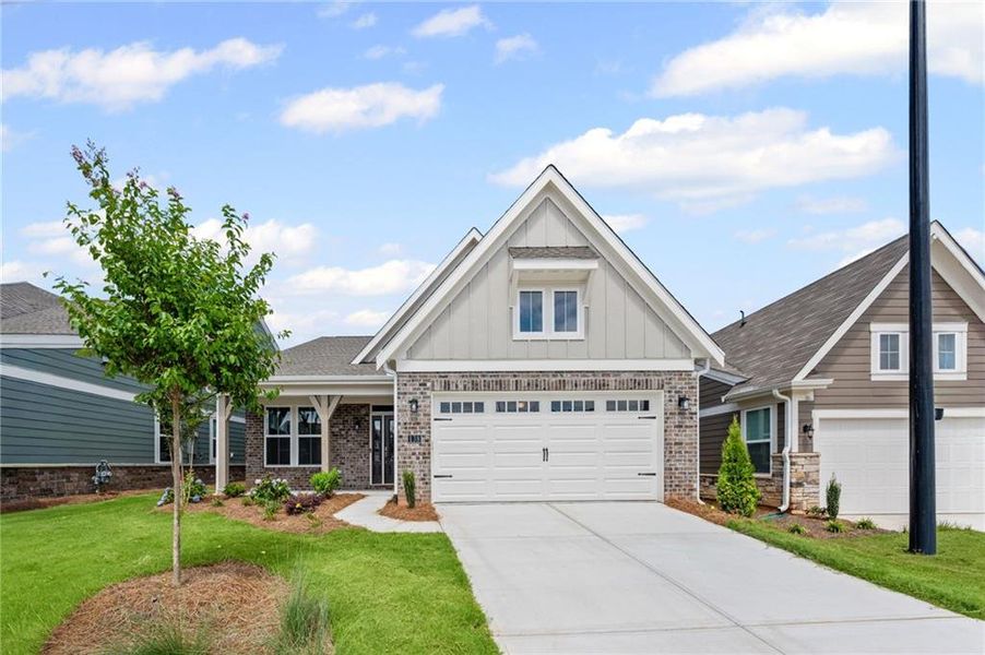 Front exterior of a new home in Laurel Farms, Dallas, GA, highlighting curb appeal (Image 22).