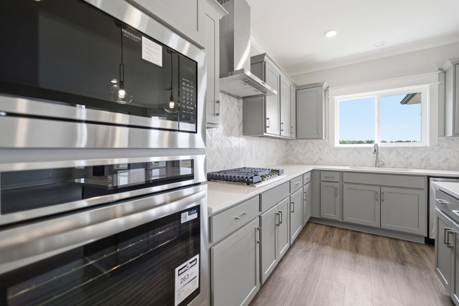 Furnished interior view inside a new home in Aden Woods, Fairview (Image 9).