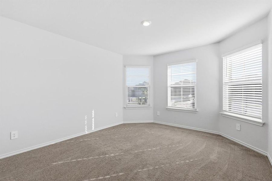 Bedroom 1 with carpet, bay window-could be used as an office Bedroom 1 with carpet, bay window-could be used as an office