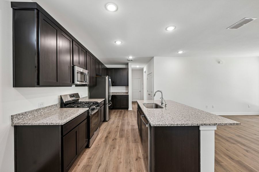 Representative furnished interior of a home built from the 3501 by Risewell Homes in Parkton Square, Kyle (Image 5).